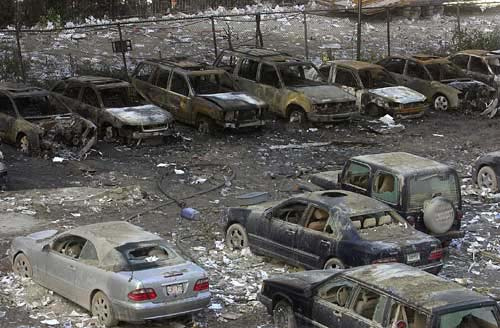 Burned out cars in parking lot near ground zero